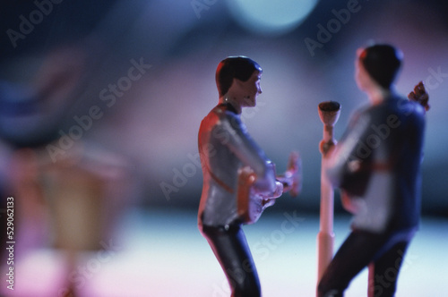 Toy model of two men playing guitars
