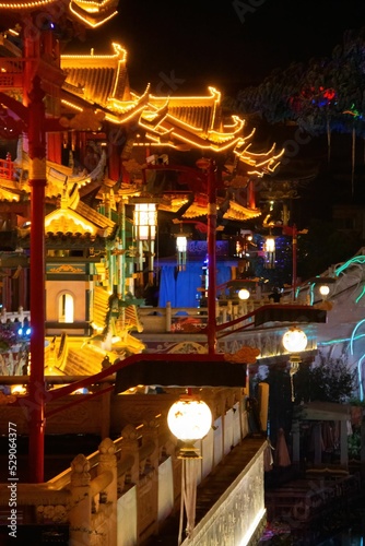 Vertical shot of the illuminated Impression Water street in Meishan city, China photo