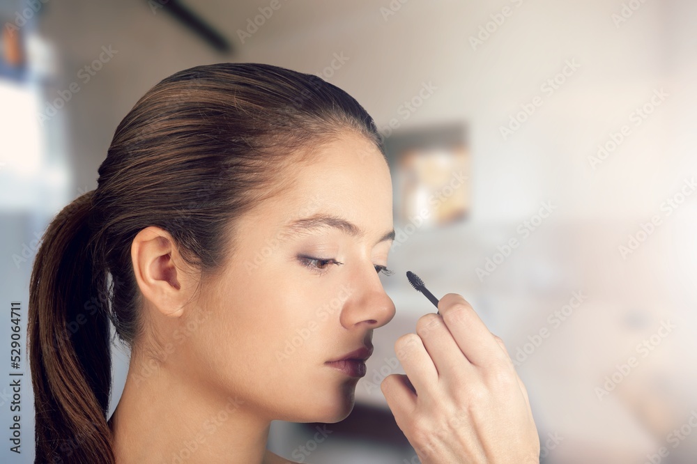 Daily Makeup. Smiling Young Female Applying Makeup In Bathroom, Beautiful Happy Woman Using New Cosmetics Daily Makeup. Smiling Young Female Applying Makeup In Bathroom, Beautiful Happy Woman Using New Cosmetics