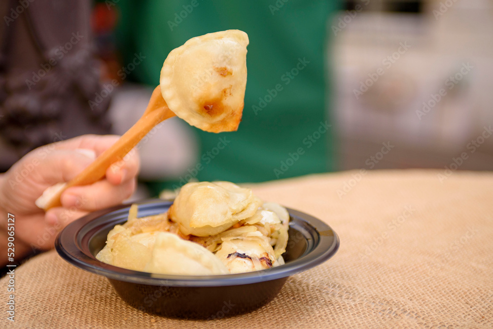Appetizing dumplings with cabbage in a summer cafe. Vegan version of traditional food.
