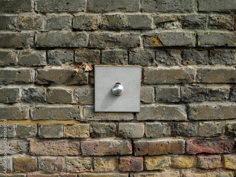 Old Brick wall weathered and damaged with supports Old Brick wall weathered and damaged with supports