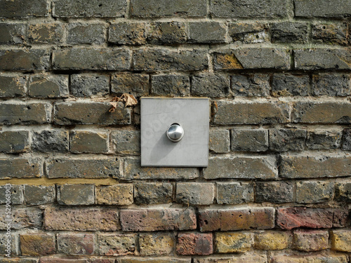 Old Brick wall weathered and damaged with supports