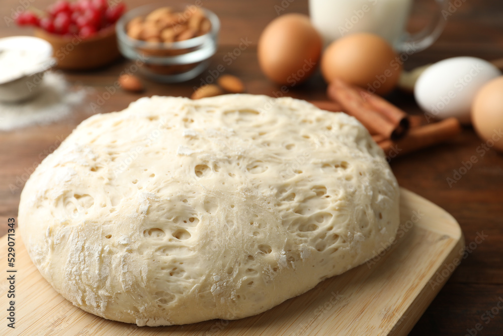 Board with wheat dough for pastries, closeup Board with wheat dough for pastries, closeup