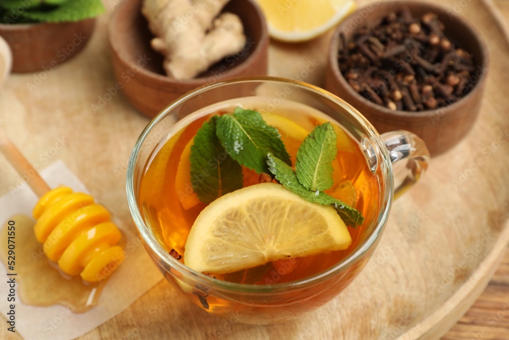Immunity boosting drink and ingredients on wooden tray Immunity boosting drink and ingredients on wooden tray