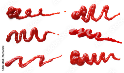 Set with tasty ketchup on white background