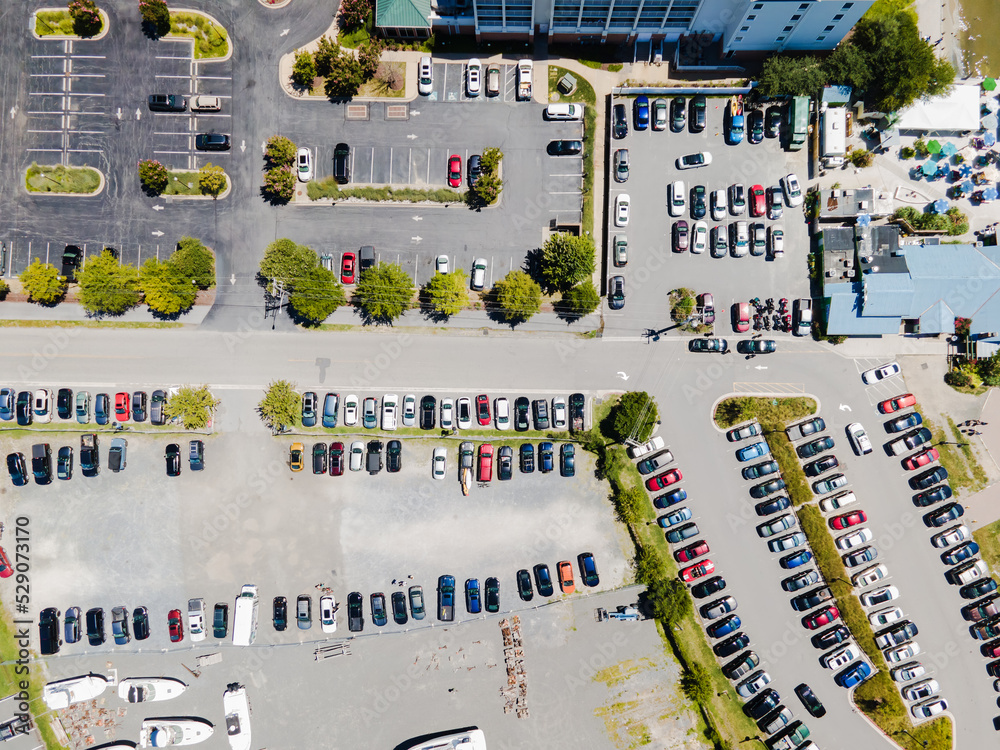 View of the parking for cars and yachts near the bay with the marina, View from above.