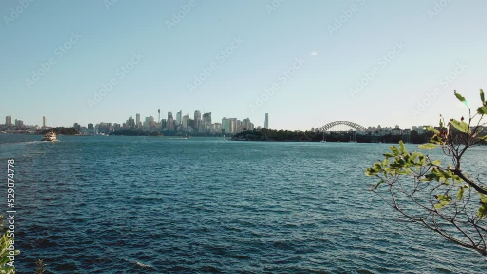A typical Sydney afternoon cityscape view from across the harbour. A typical Sydney afternoon cityscape view from across the harbour.