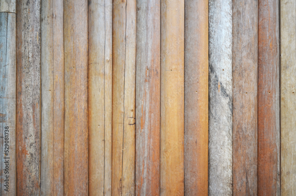 Natural log wall texture background. Fence lined with old logs. Natural log wall texture background. Fence lined with old logs.