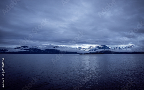 icy mountain near water 