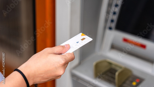 Atm machine cash. Money bank credit card holding hand. Withdraw money cash from atm. Bank credit card withdraw dollar bill.