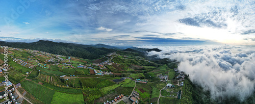 Fly aerial view above the clouds and sky in sunrise time mist among mountain at Phu Thap Boek- Phetchabun Province, Inspiration concept.