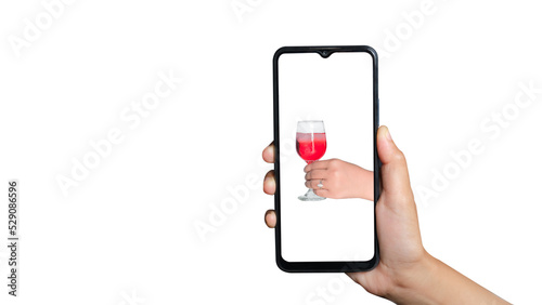Person holding phone with glass of syrup on screen vertically. can be used for advertising purposes, holiday, summer. White background with clipping path.