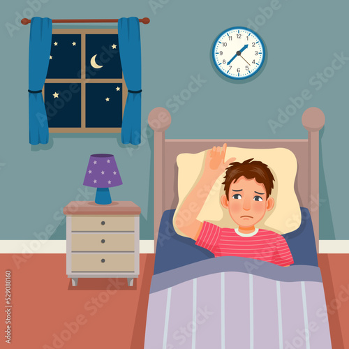 young man has insomnia sleepless staying awake in the bed at night