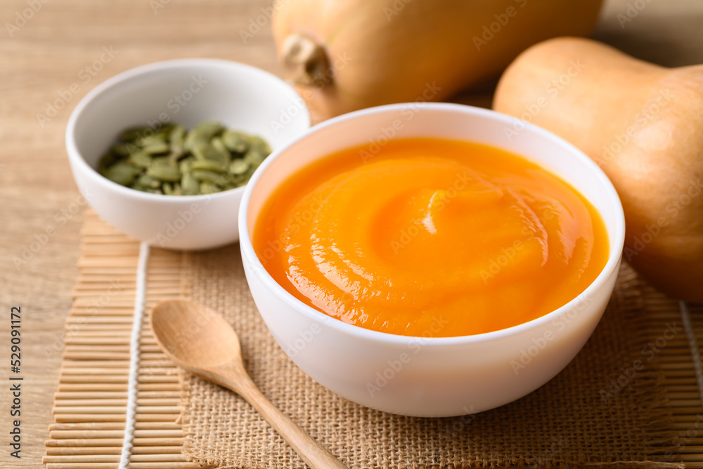 Butternut squash pumpkin soup in bowl, Homemade food in autumn season Butternut squash pumpkin soup in bowl, Homemade food in autumn season