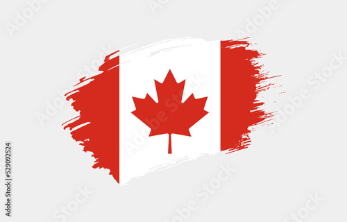 Creative hand drawn grunge brushed flag of Canada with solid background
