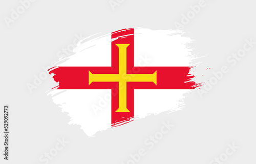Creative hand drawn grunge brushed flag of Guernsey with solid background