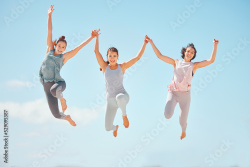 Fitness, sports friends or women jump with blue sky mockup and background. Wellness, energy and carefree people jumping in fun workout training or exercise outdoor in summer with sunshine and mock up