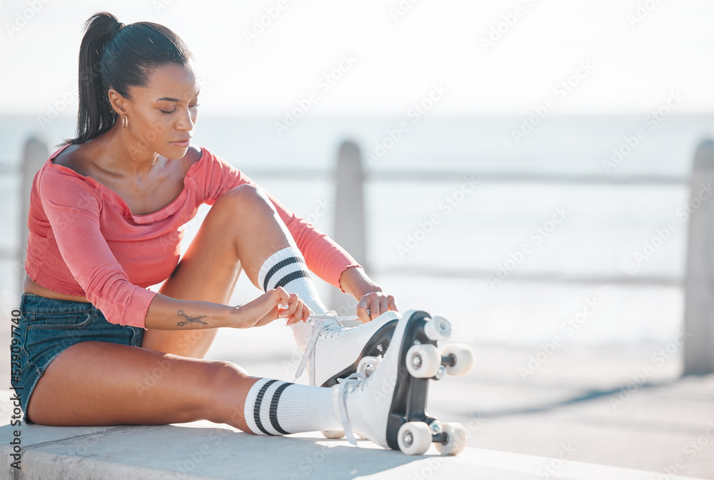 Fitness, exercise and happy woman roller skating along a beach on a sunny  day, content while