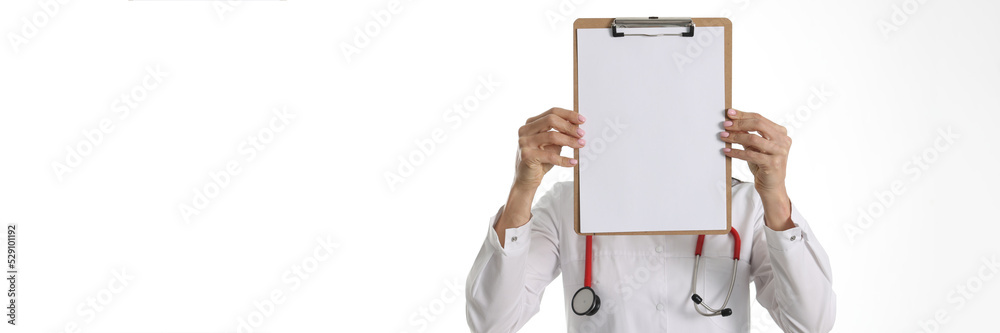 Doctor is holding white sheet of paper closeup Doctor is holding white sheet of paper closeup