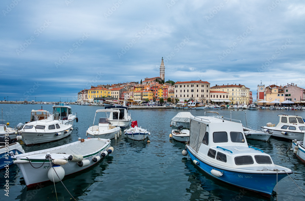 Boats are moored along the marinas of Old Town Rovinj in Croatia
