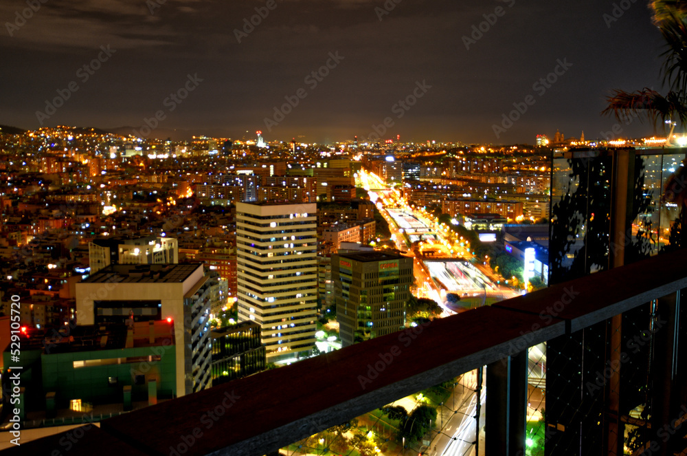 A night time long exposure view of the Barcelona sprain skyline.