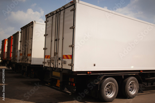 Shipping Cargo Containers. Semi Trailer Trucks on Parking. Shipping Truck. Delivery Transit. Industry Freight Trucks Logistics Cargo Transport. 
