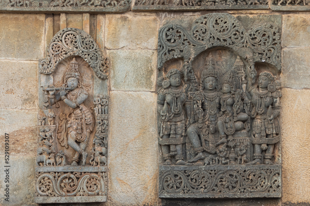 The Sculpture of Lord Shiva Parvati and Lord Krishna With Flute on the Chennakeshawa Temple, Belur, Hassan, Karnataka, India.