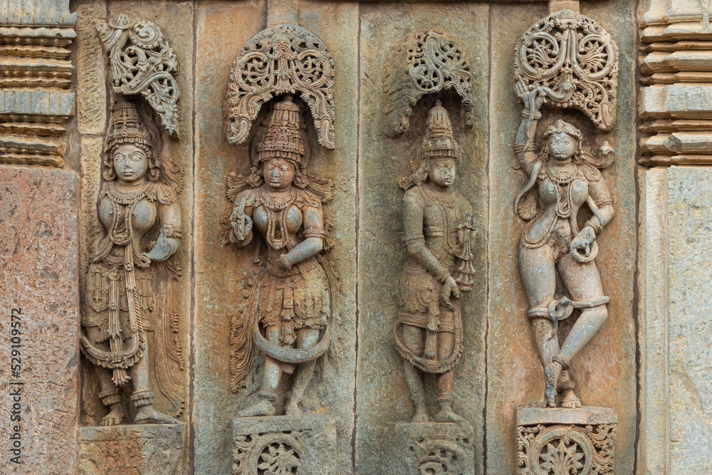 Depicting of  Hindu God and Goddess on the Chennakeshawa Temple, Belur,  It was commissioned by King Vishnuvardhana in 1117 CE, Hassan, Karnataka, India.