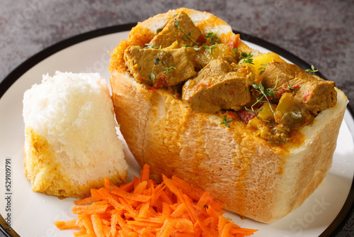 traditional durban mutton bunny chow closeup on plate on the table. Horizontal photo