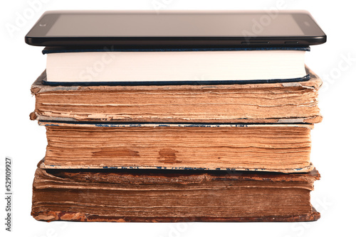 Obraz na płótnie Stack of old and new books, digital tablet isolated on white. New technology concept. Choice between paper books and e-reader. Closeup. w salonie