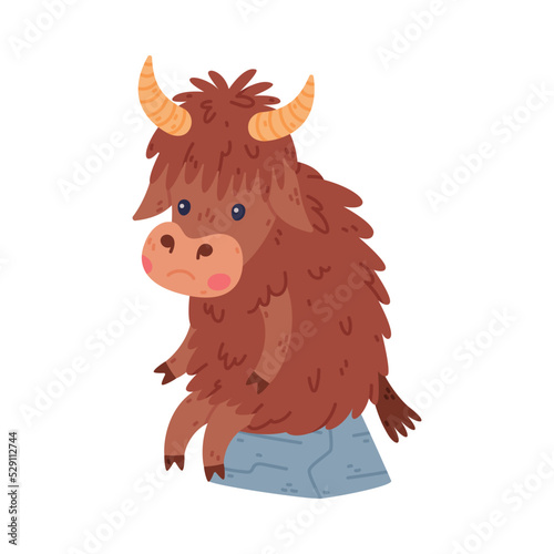 Cute Yak Character with Dense Fur and Horns Sitting on Stone with Sad Face Vector Illustration