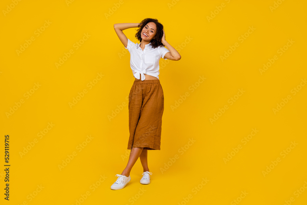 Full size photo of pretty nice lady wavy chevelure hairdo blank space make picture for banner isolated on yellow color background Full size photo of pretty nice lady wavy chevelure hairdo blank space make picture for banner isolated on yellow color background