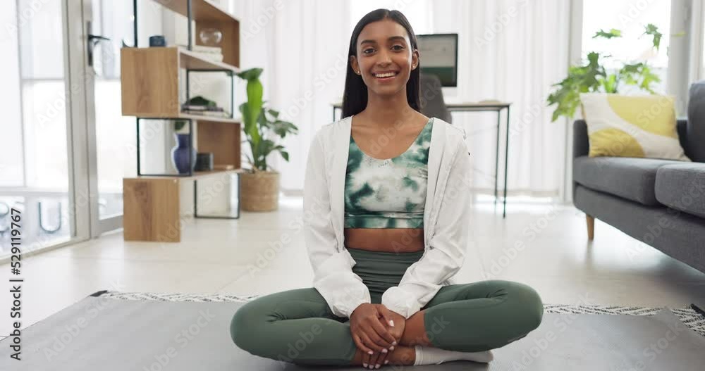 Yoga, fitness and exercise with a woman training with a workout in her home for health and wellness. Healthy, zen and meditation with a young female athlete sitting on a mat in the living room Yoga, fitness and exercise with a woman training with a workout in her home for health and wellness. Healthy, zen and meditation with a young female athlete sitting on a mat in the living room