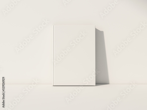 White Book Mockup front view with blank hard cover standing on white table. 3d rendering