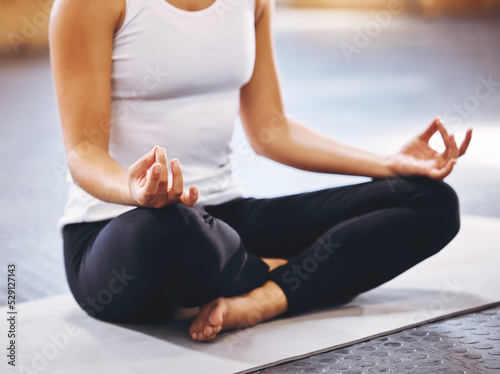 Meditation, wellness and zen woman doing yoga, pilates or meditate for spiritual energy, mind and mindset health. Mindfulness, lotus and a girl sitting on floor to relax, peace and breathing exercise