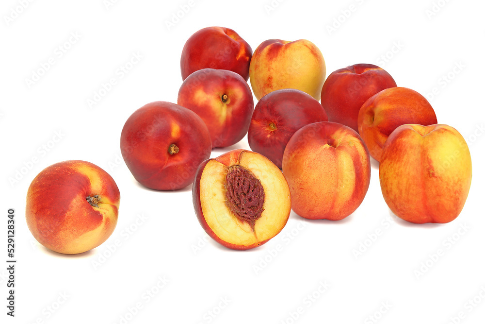 Scattered nectarines isolated on white background