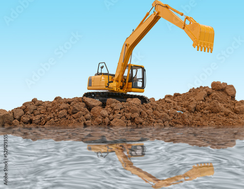 Crawler excavator is digging with lift up in the construction site ,water reflection shadow on blue background