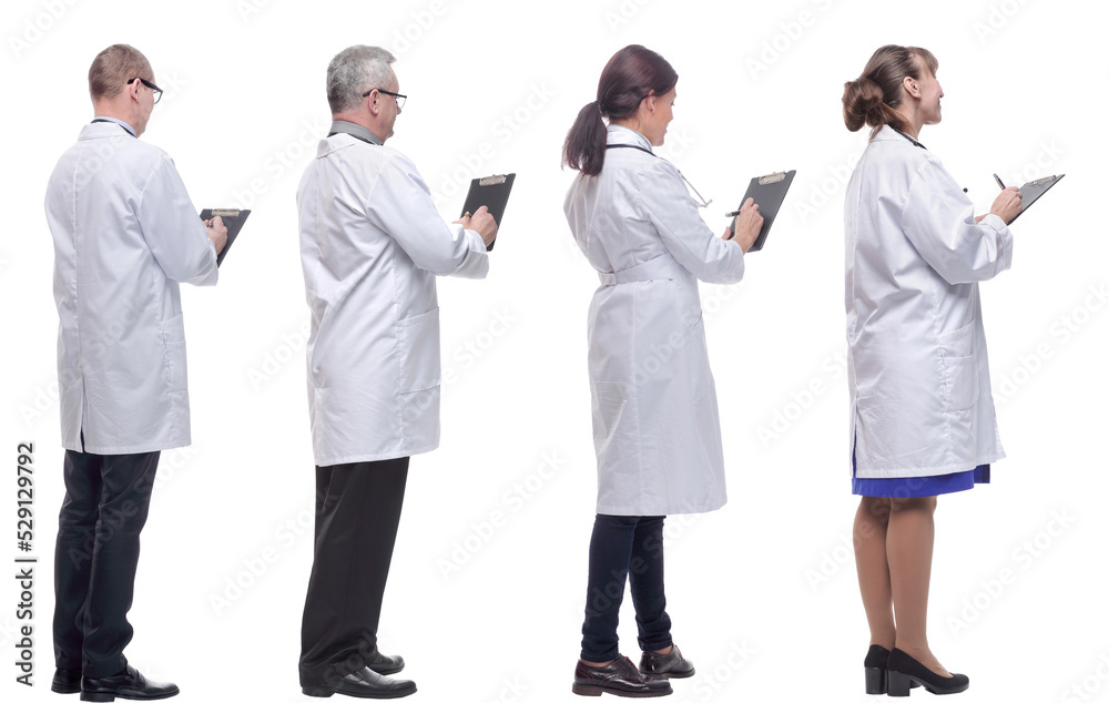 group of doctors standing with their backs isolated on white group of doctors standing with their backs isolated on white