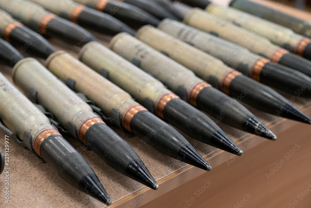 Bullets on table as background, close up view. Bullets on table as background, close up view.