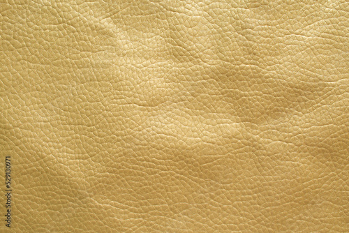 Genuine leather texture background. Gold artificial leather leather background.