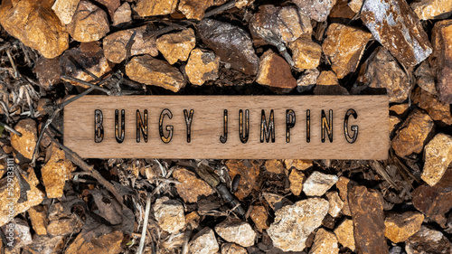 Fotografia Bungy jumping written on wooden surface