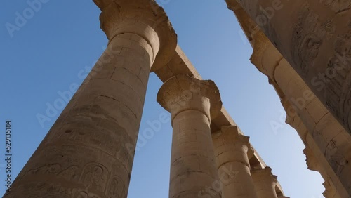 Hand-held Close-up Shot Of The Luxor Temple Pillars Showing The Engraved Hieroglyphics On The Pillars, Egypt photo