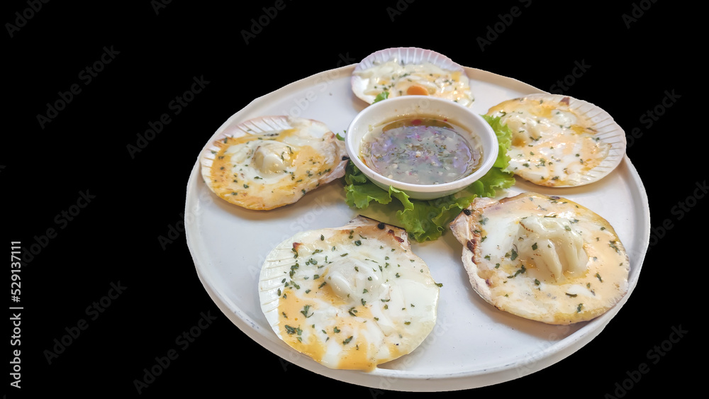 Isolated Baked Scallops with Cheese and Dipping on black background.
