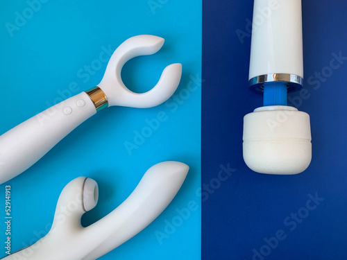 Three vibrators on a blue background. Useful for sex shop or adults