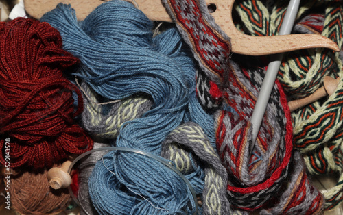 needlewoman's box with threads, knitting needles and braid