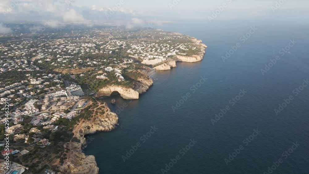 Aerial view of the coastline facing the Atlantic Ocean in Carvoeiro, Algarve region, Portugal. Aerial view of the coastline facing the Atlantic Ocean in Carvoeiro, Algarve region, Portugal.