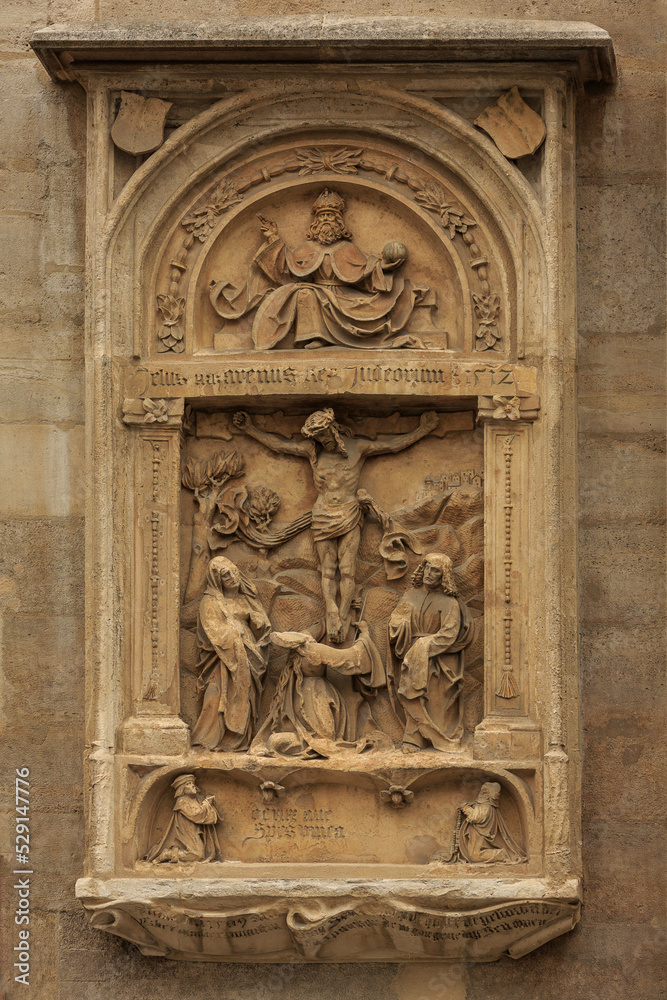 The bas-relief on the wall of the cathedral in Vienna in Austria close-up. Nice view of the religious, Gothic architecture and historical art.