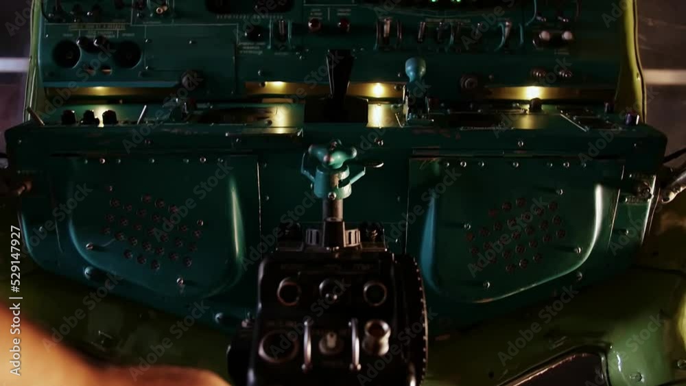 Hand touches the upper control panel of the aircraft. Latitude altitude ...