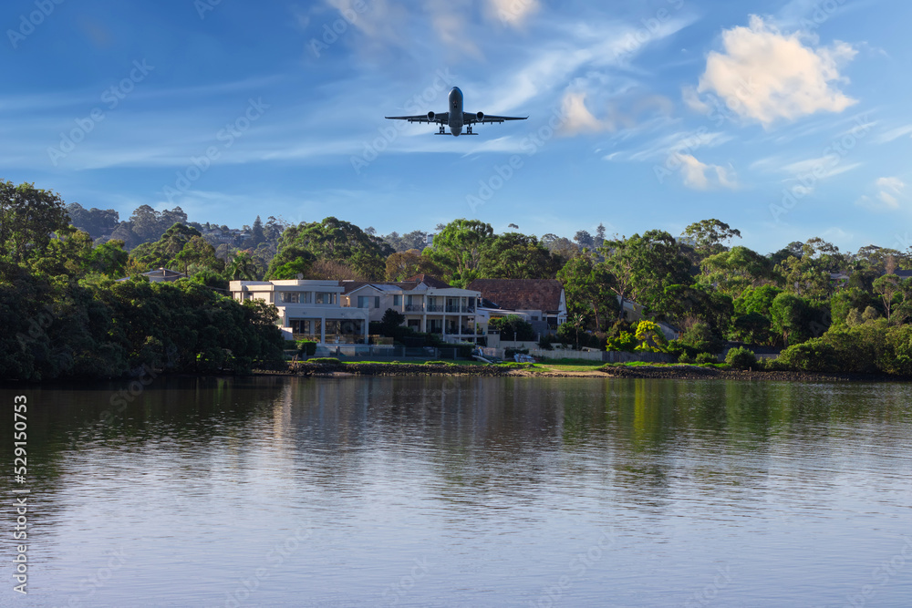 Plane flying over Sydney Harbour Sydney NSW Australia. 