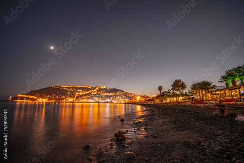 Alanya Town in Antalya, Turkey boats on the beach at sunset